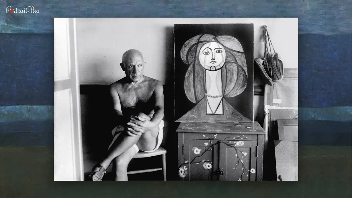 Image of famous painter Pablo Picasso with his one of the famous painting "Woman With Yellow Necklace" who also painted The Old Guitarist