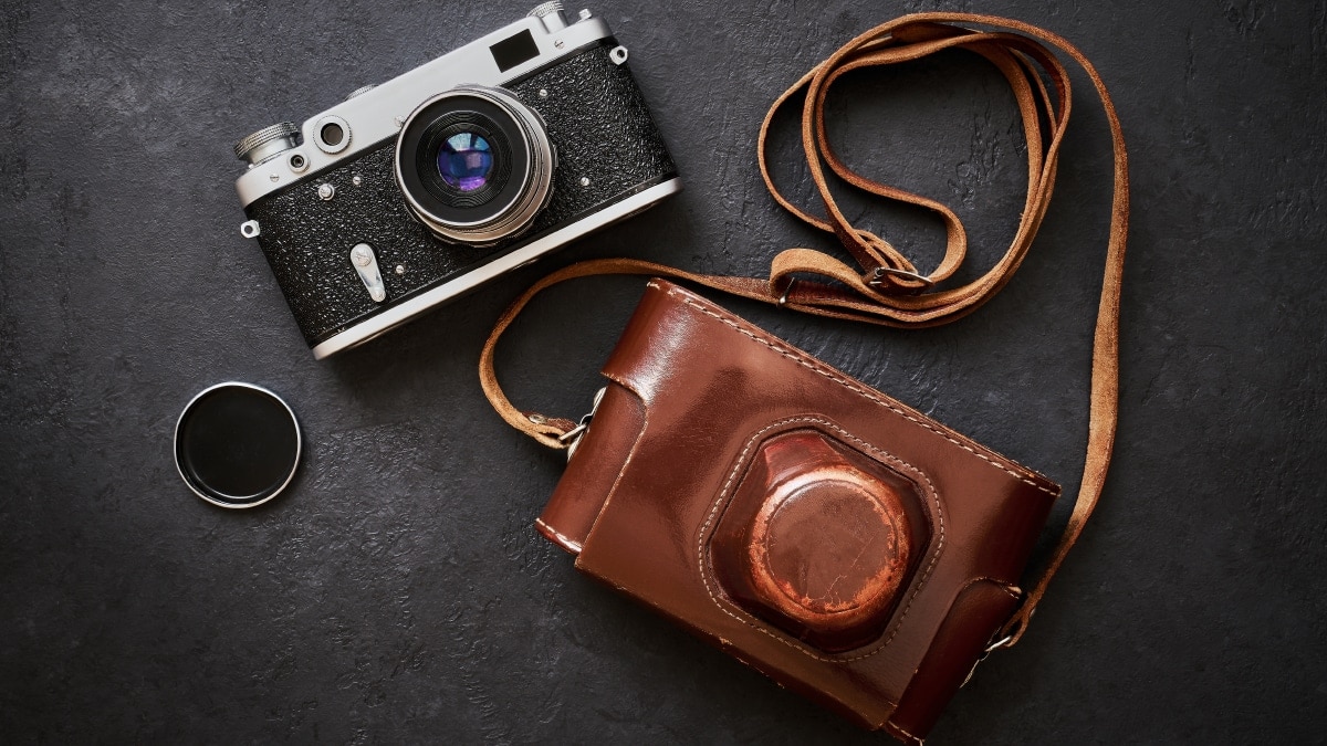 Classic leather camera straps that is brown in color on display