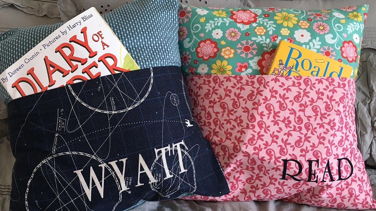 Colorful personalized reading pillow with books inserted into it