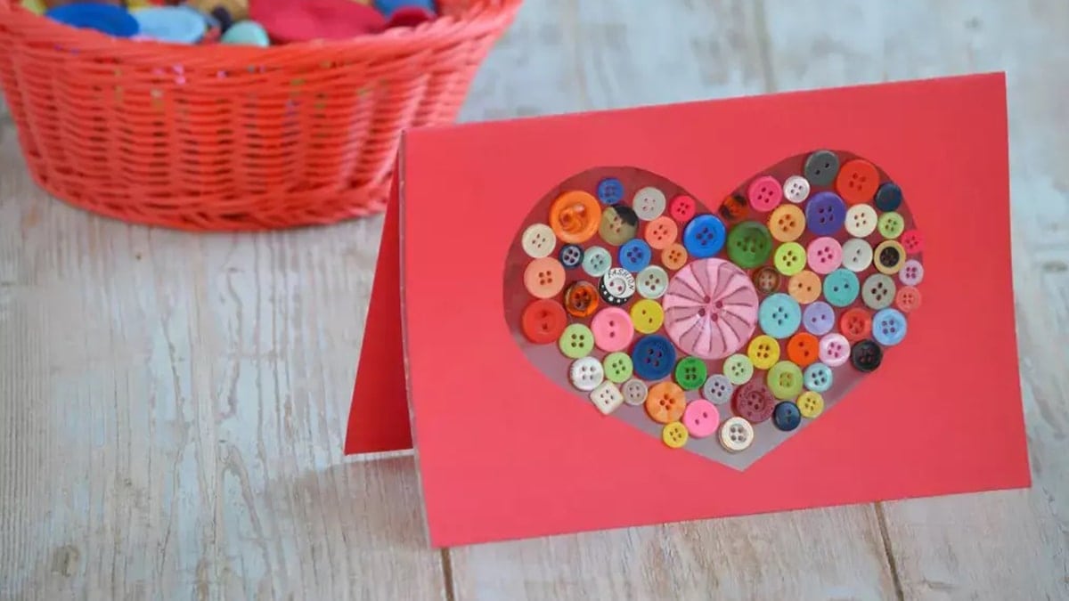 a handmade red color button heart card 