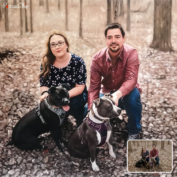 Anniversary portraits of a couple where the man and woman are sitting in a forest area with two dogs in front of them