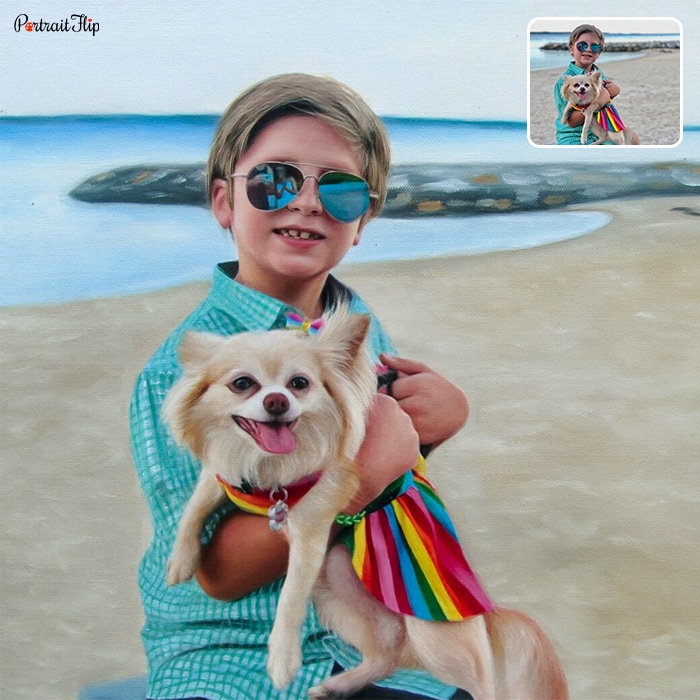 Picture of a boy holding a dog in his arms standing in a beach background