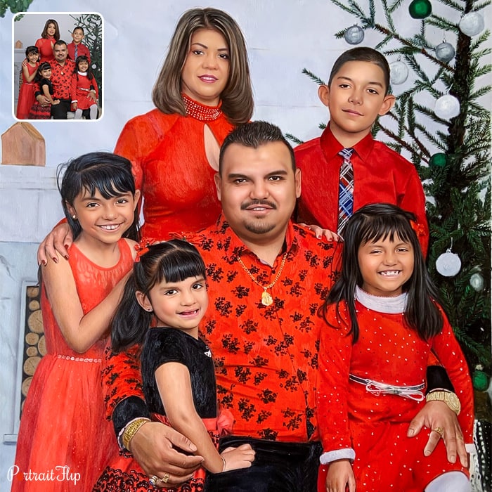 Christmas portraits of a family where a man is sitting surrounded by three girls and a boy, with a woman standing behind