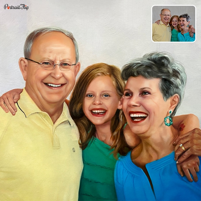 Picture of a young girl standing in between an old man and woman with her arms around them