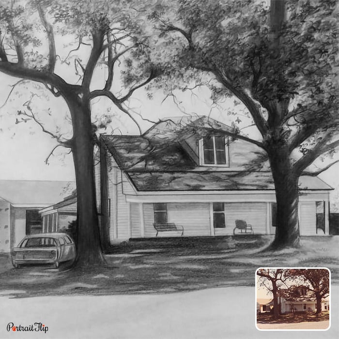 Black and white picture of a house with two huge trees in front of it