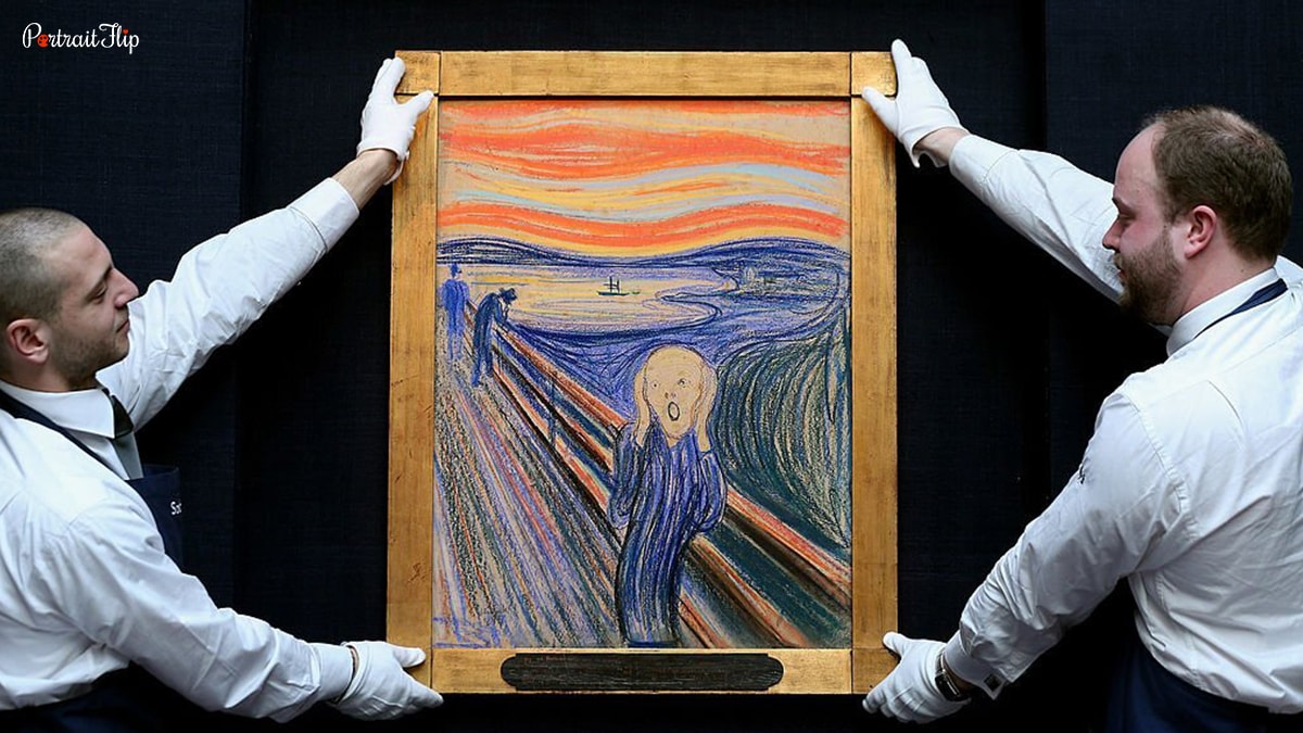 two men holding the painting The Scream. 