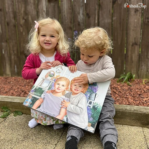 Picture of two children holding a painting in their hands