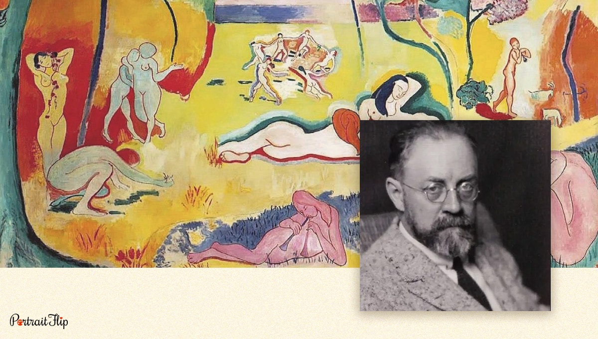 Henri Matisse's photograph with his expressionist painting in the background. 