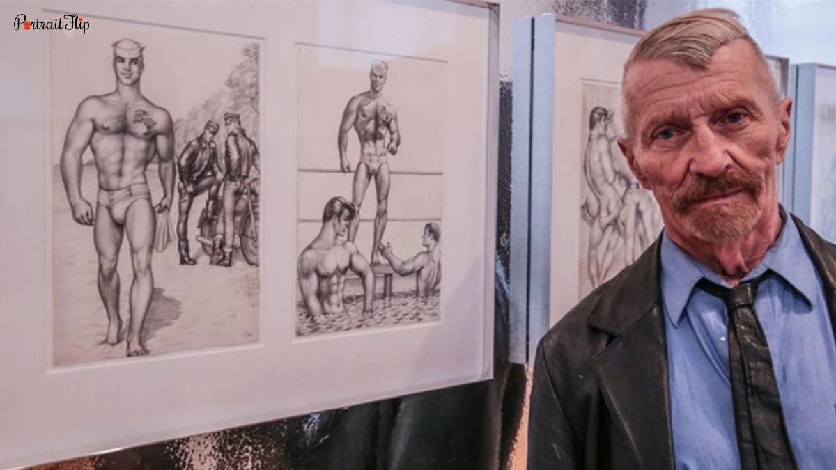 A man standing infront of the sketches of male