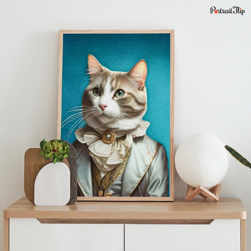 Portrait of a cat dressed as ambassador is placed on table
