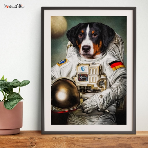 Portrait of a dog in astronaut’s outfit is placed on a table