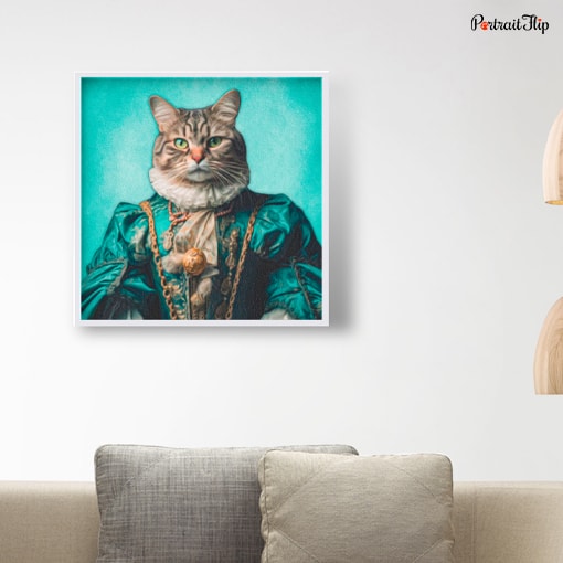 Portrait of a cat dressed as a queen is mounted on wall