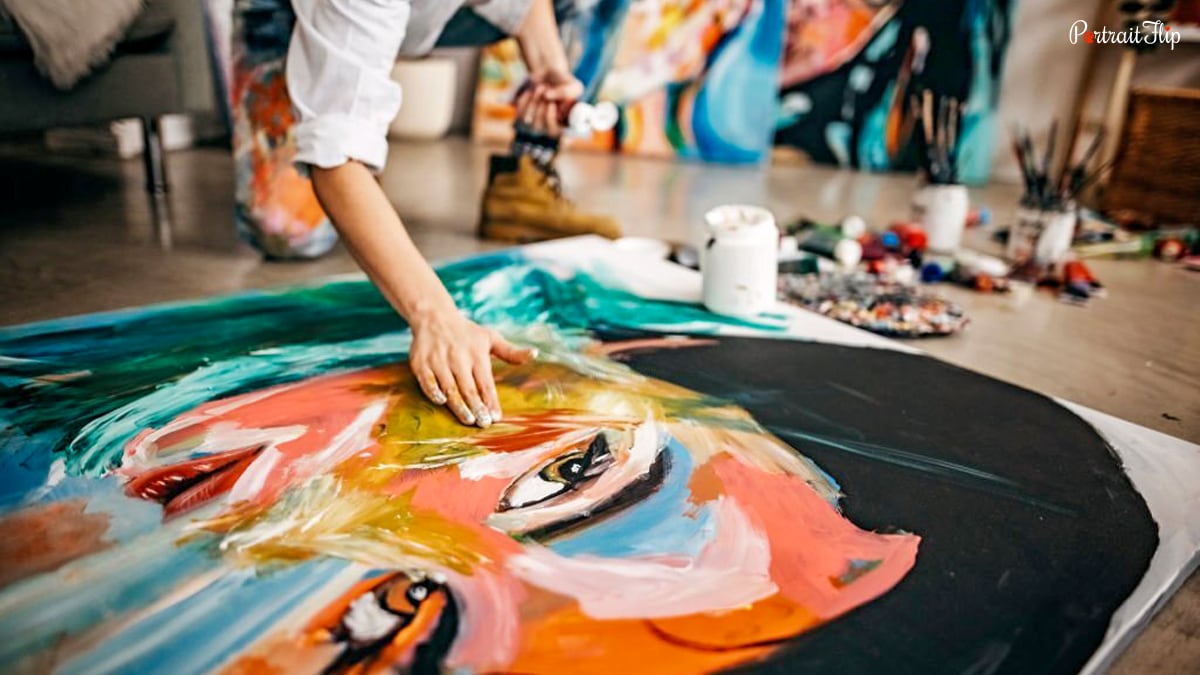 a painting of a woman's face on canvas.