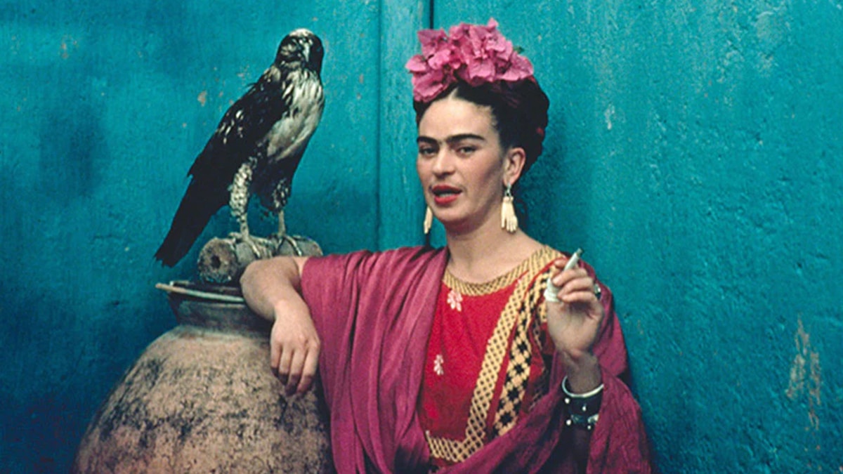 Frida Kahlo photograph with a cigarette in her hand 