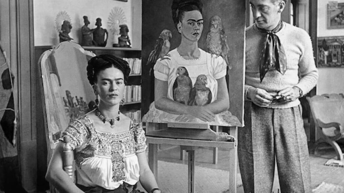 Photo of Frida Kahlo with her self-portrait 