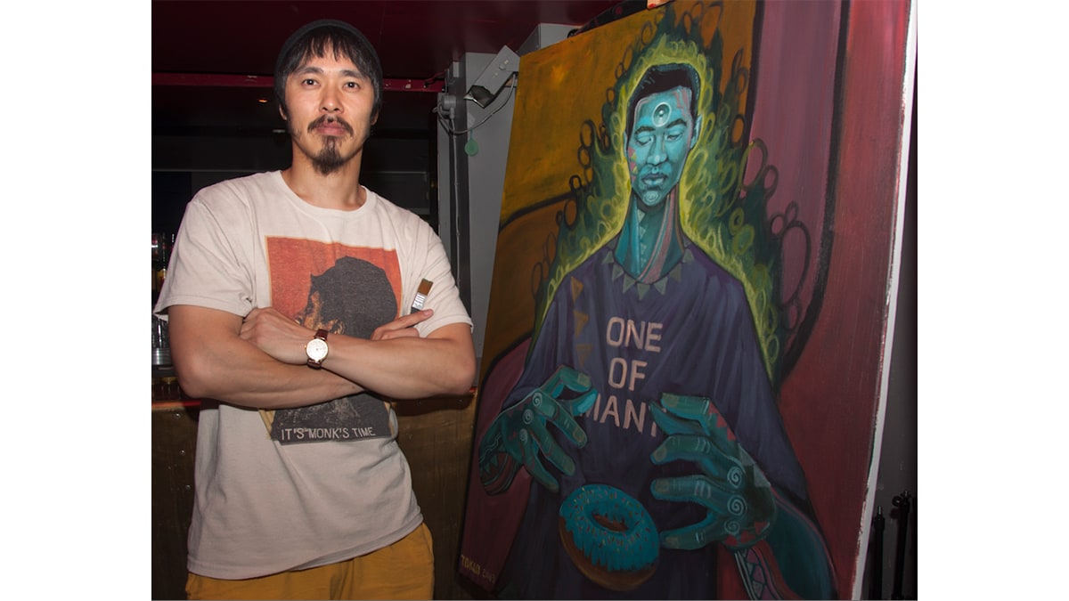 Tokio Aoyama in a standing position seeing to the viewer