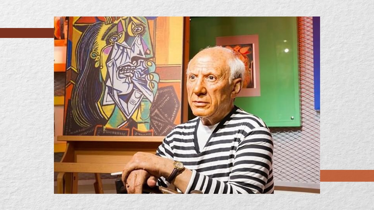 Pablo Picasso with his painting The Weeping Woman
