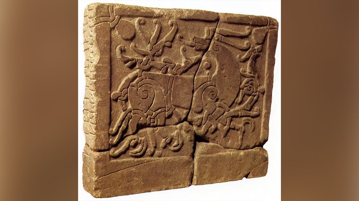 A stone depicting animals and beasts