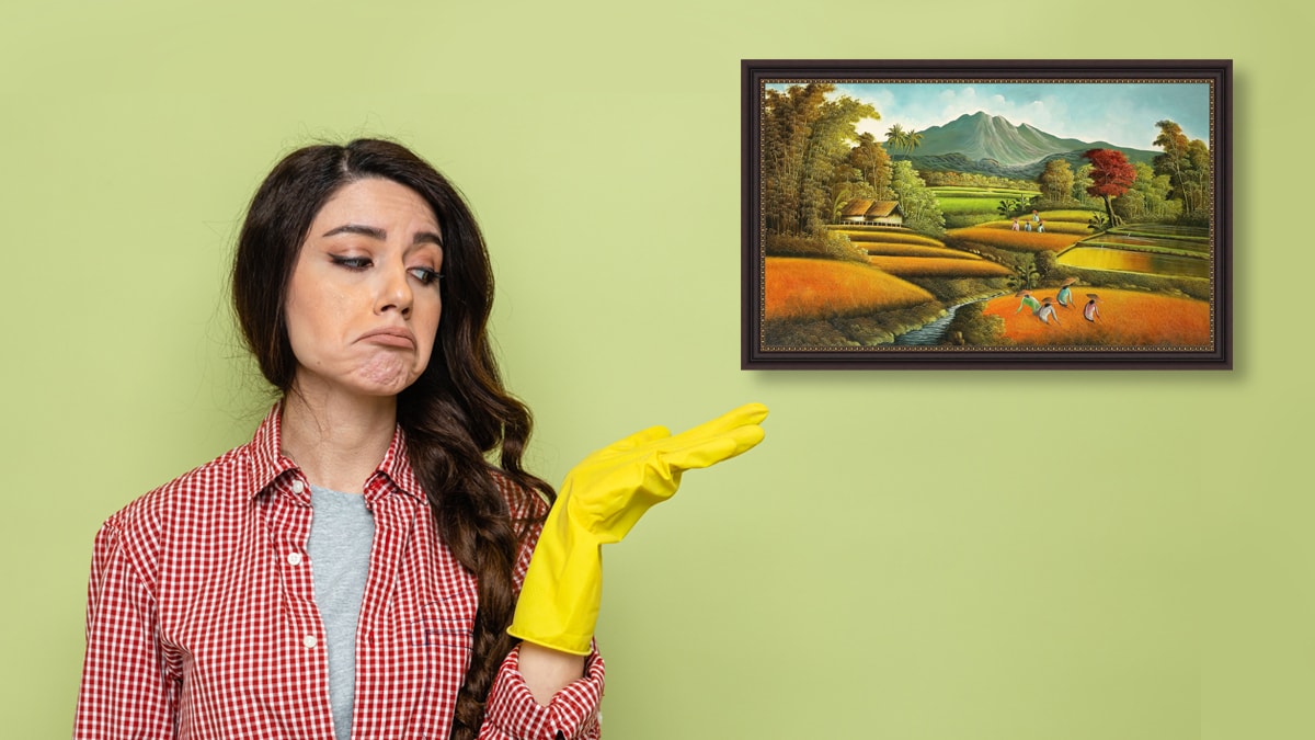 A woman pointing out towards an acrylic painting.