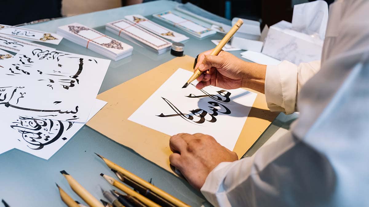 a girl making art calligraphy