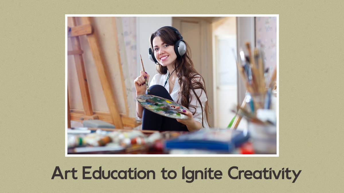 A woman smiling at the camera while she is painting