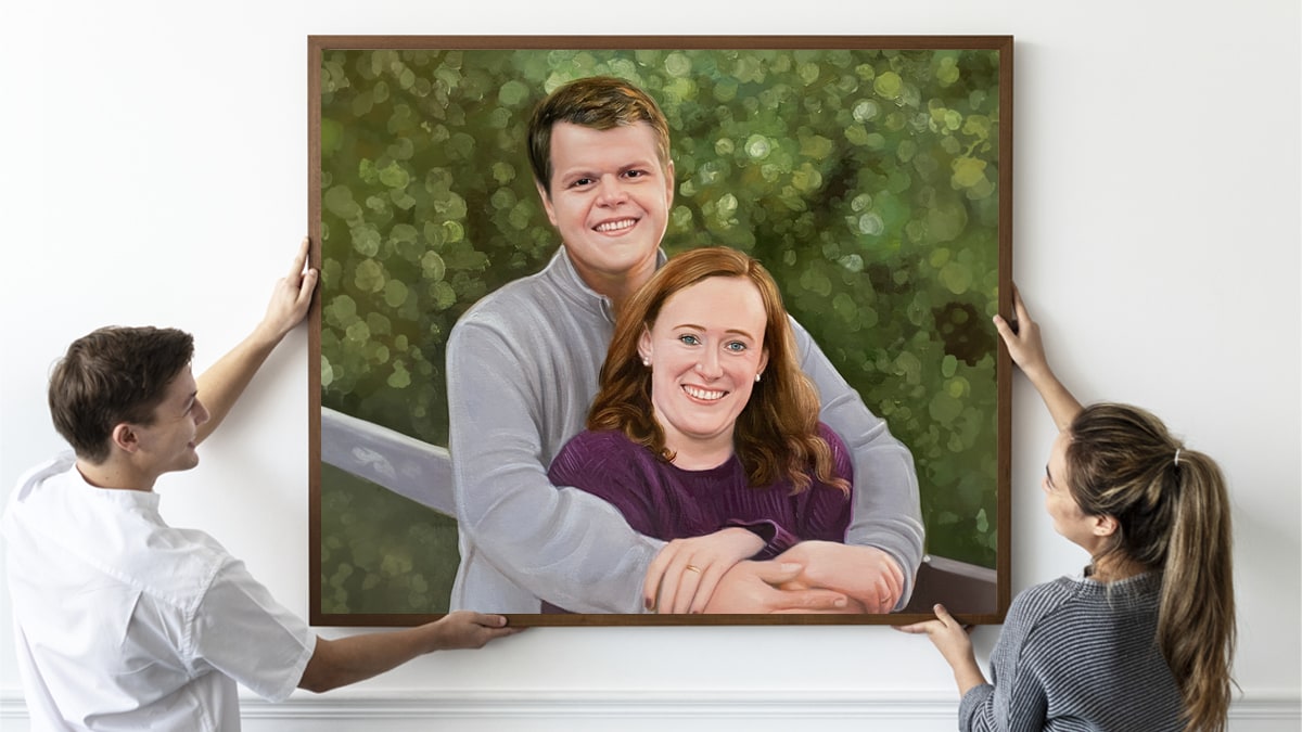 a couple holding up their painting