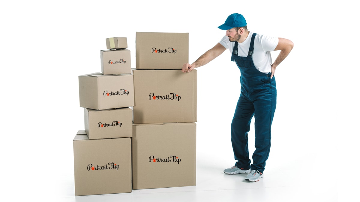 a man standing right next to box of parcels