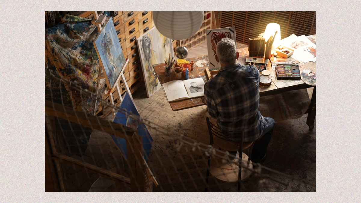 An older man in his art studio