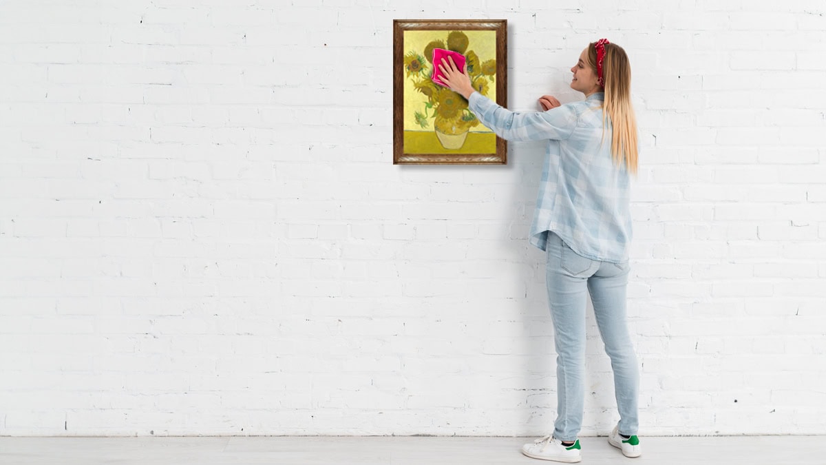 Famous Sunflower painting getting cleaned with cloth