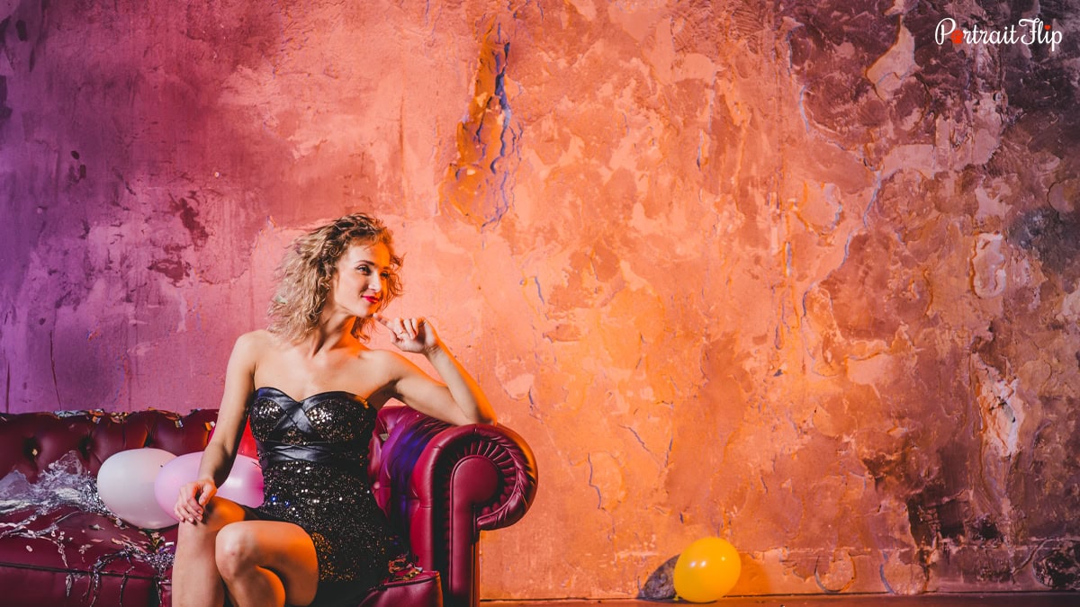 a woman with a colorful background.