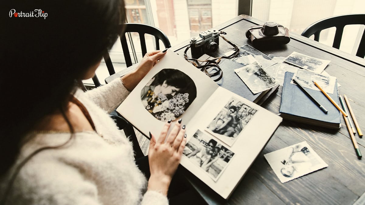 a woman looking through old photos