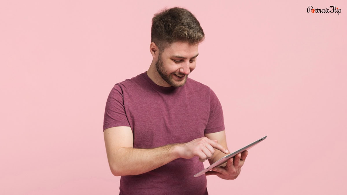 A man searching for something on tab