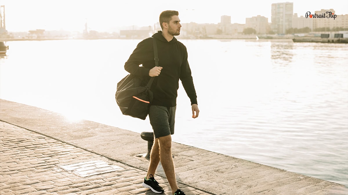 a man walking on the riverside