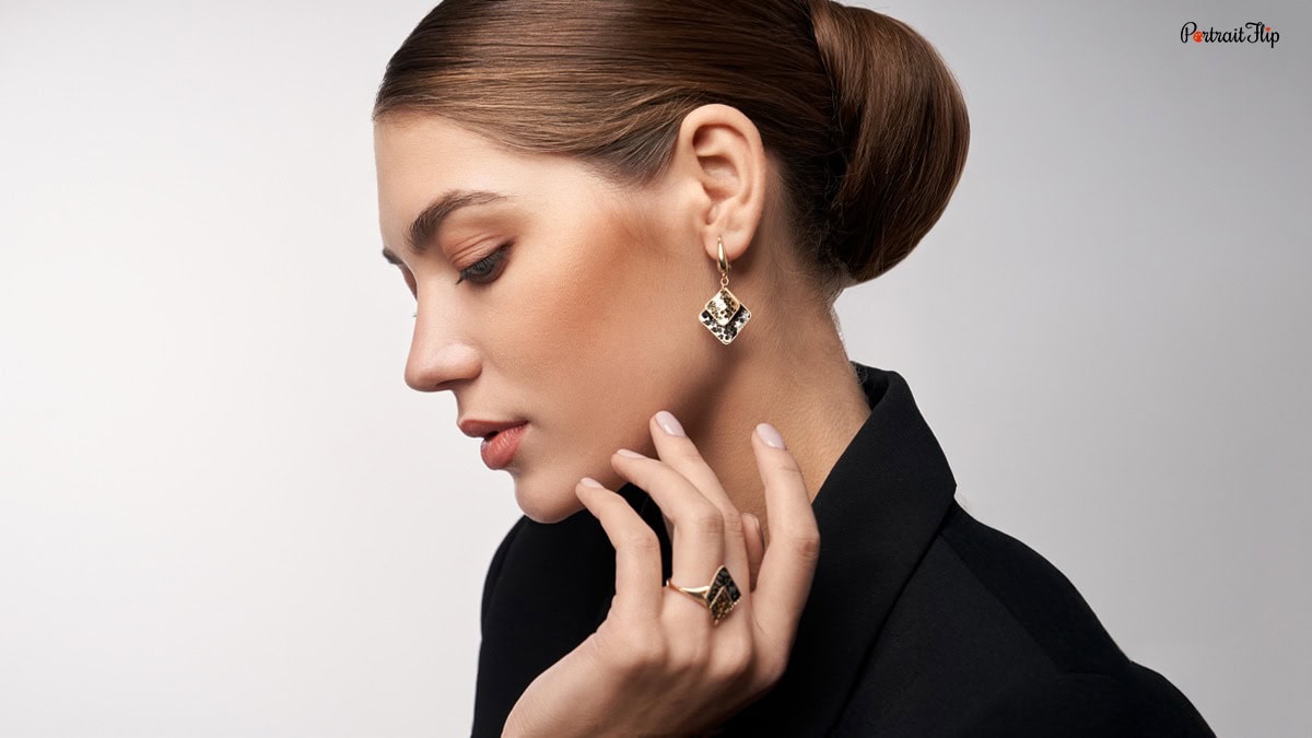 a side angled shot of a shot with beautiful earrings