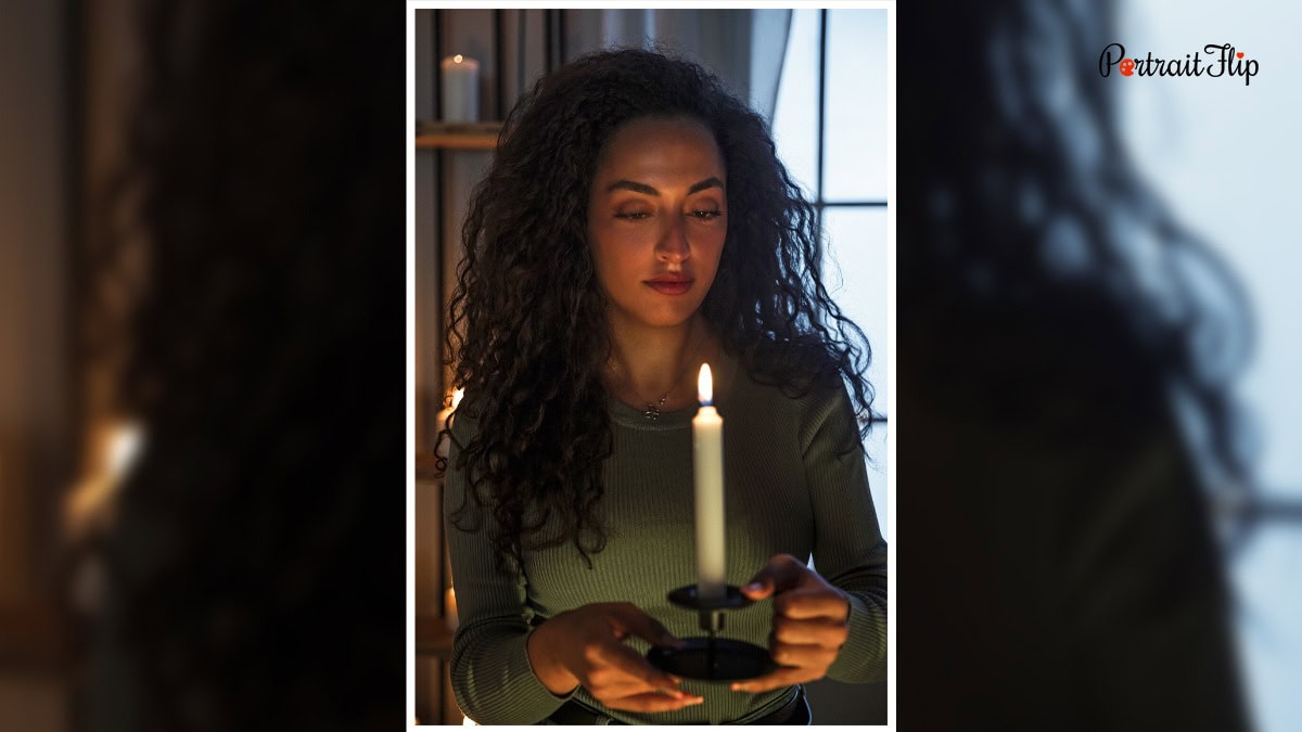 A woman with a candle in her hand