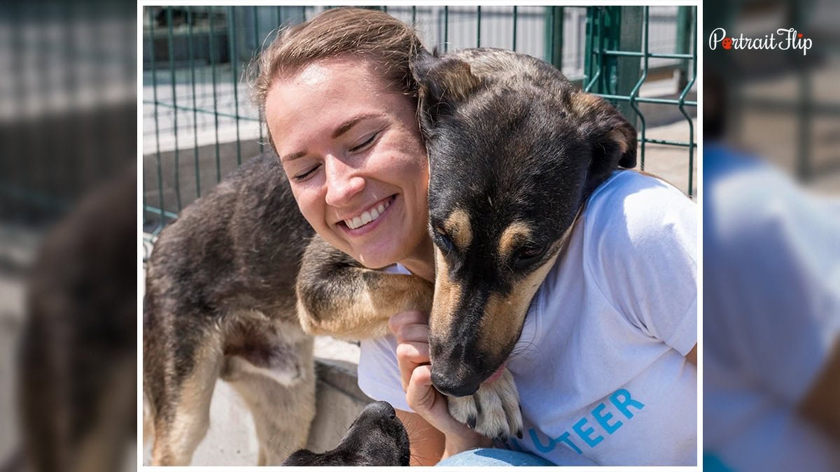 A woman and dog hugging each other