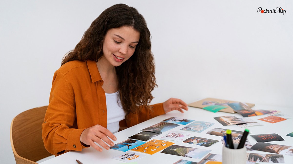 Woman arranging the photos into collage
