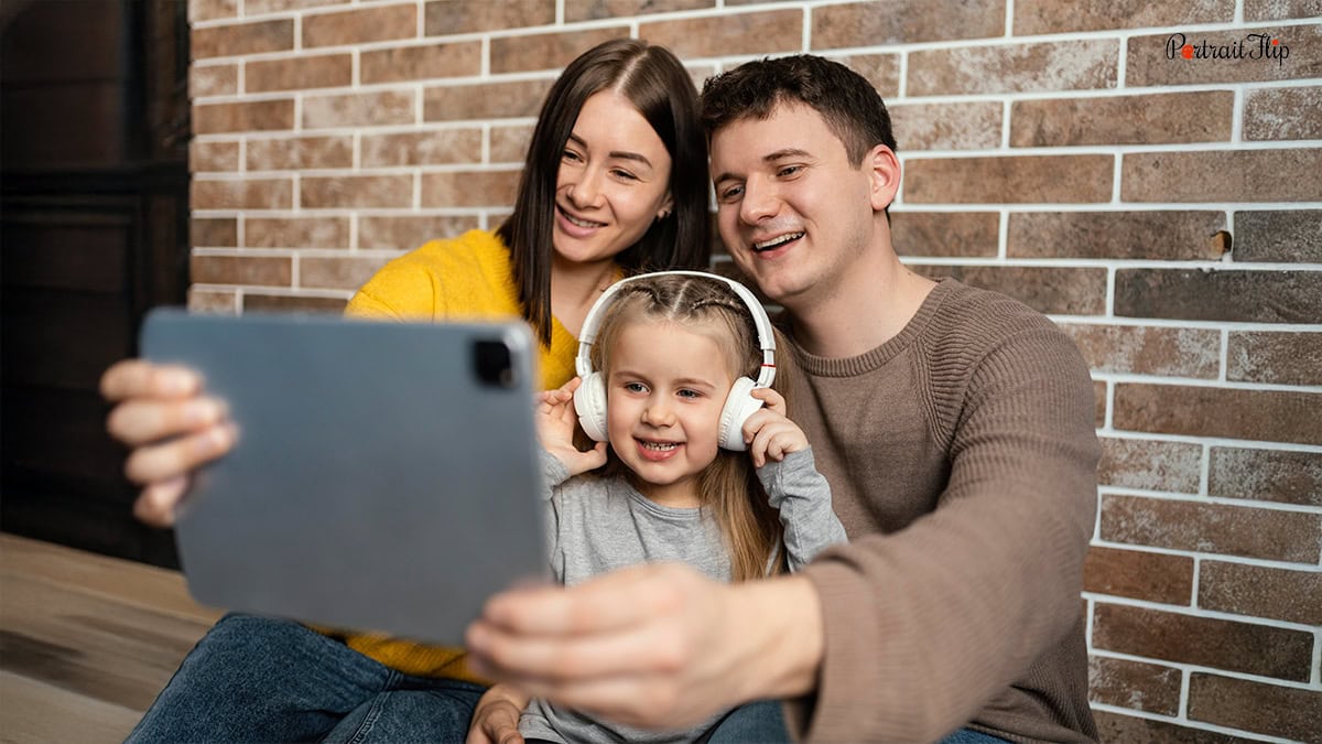 Family posing in a selfie mode